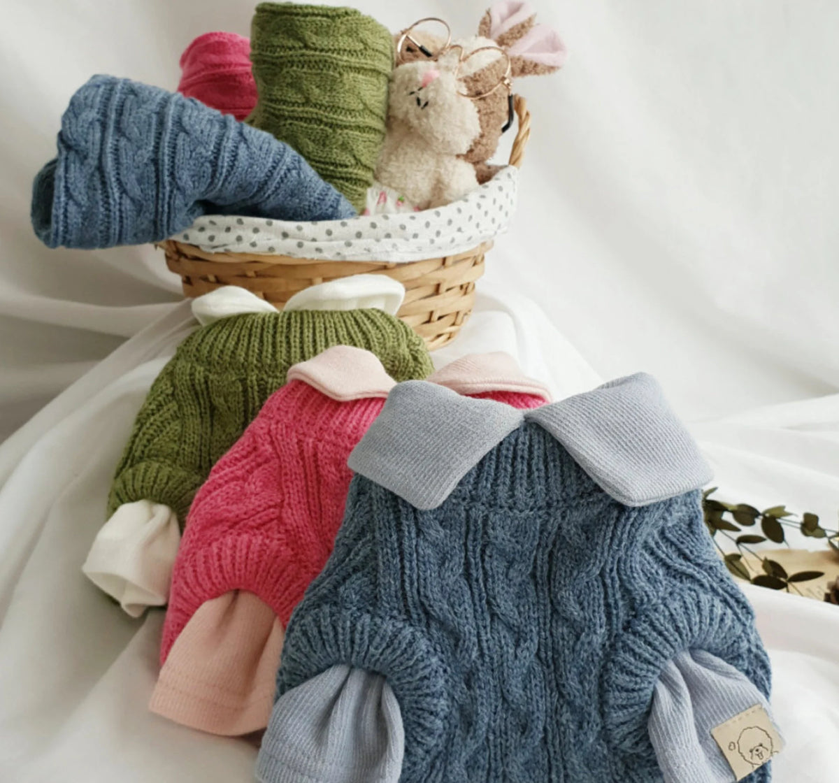 Three sweater colors styled with separate collared shirts